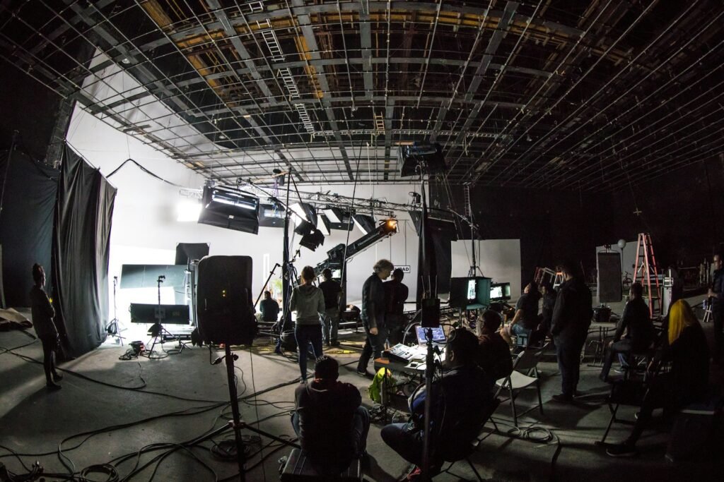Film production set with crew and lighting