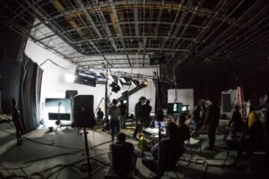 Film production set with crew and lighting