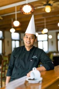 Professional chef portrait in white uniform