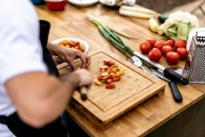 Chef preparing and plating food in a home kitchen
