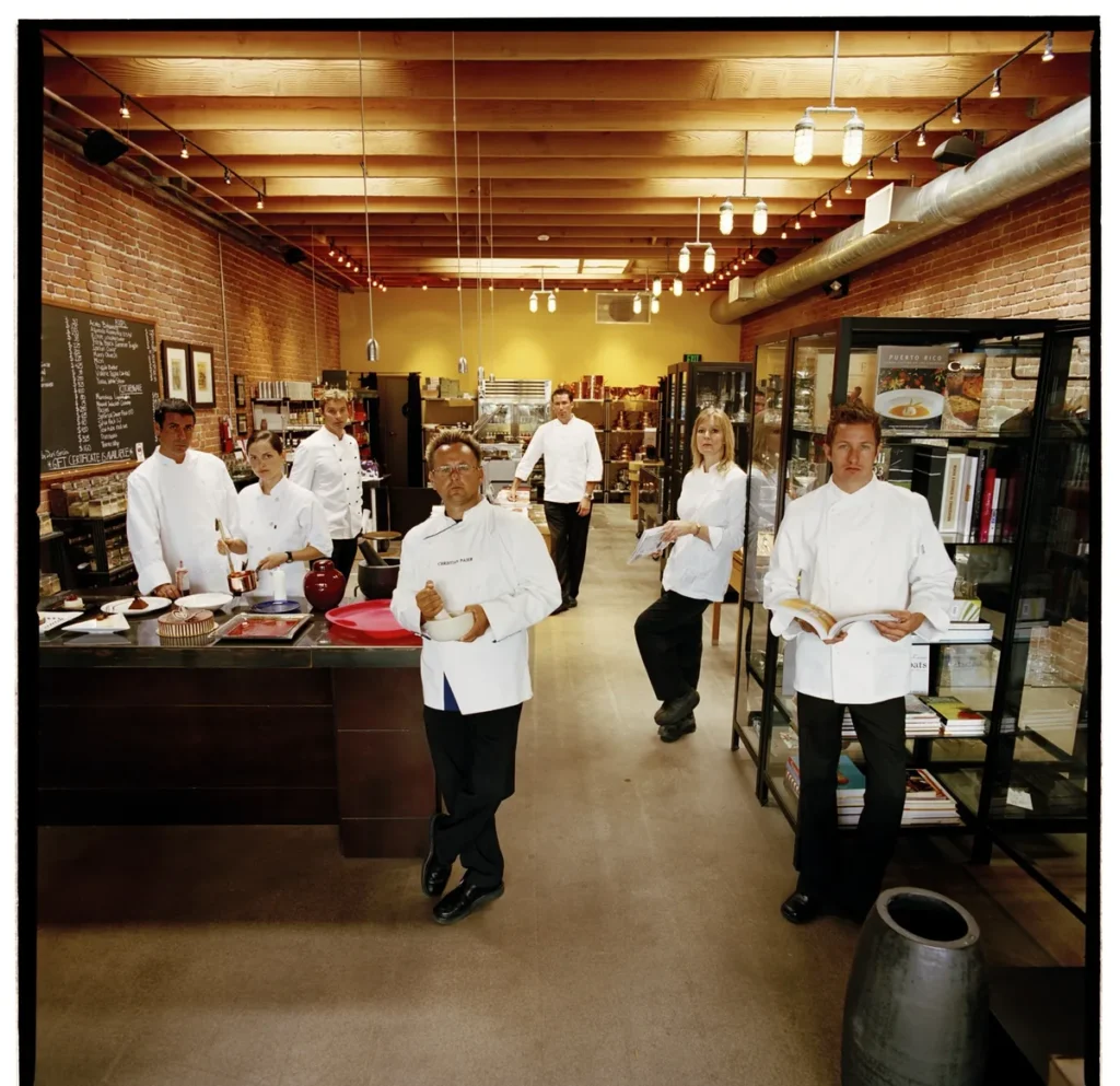 A proffessional team of Private Chefs standing in a premium kitchen setting, representing the nation's largest private culinary network