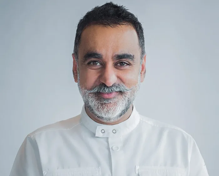 Michelin-starred private chef in a white chef jacket