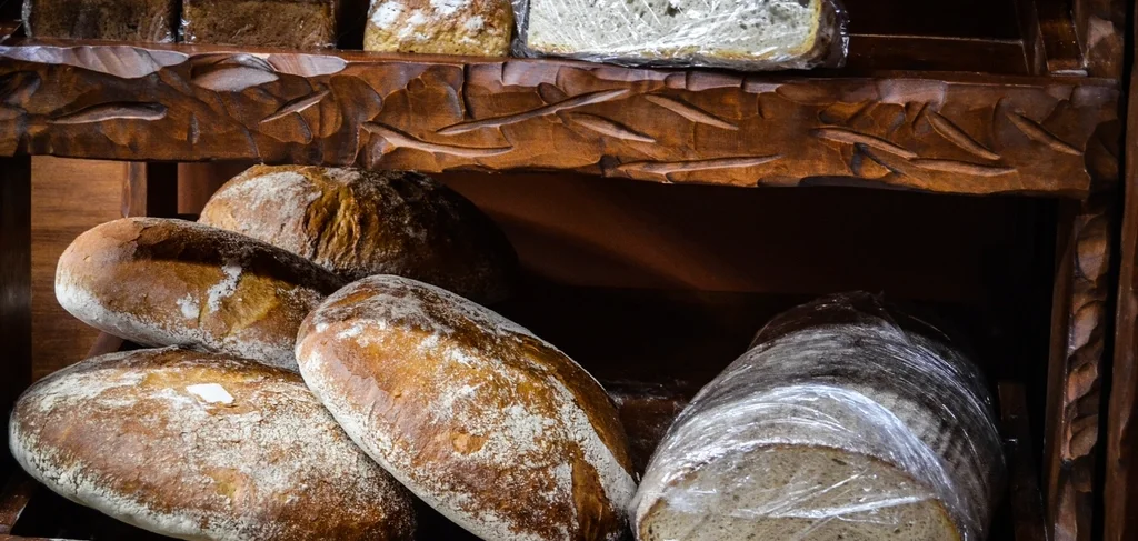 Artisan hearth bread loaves on bakery shelves