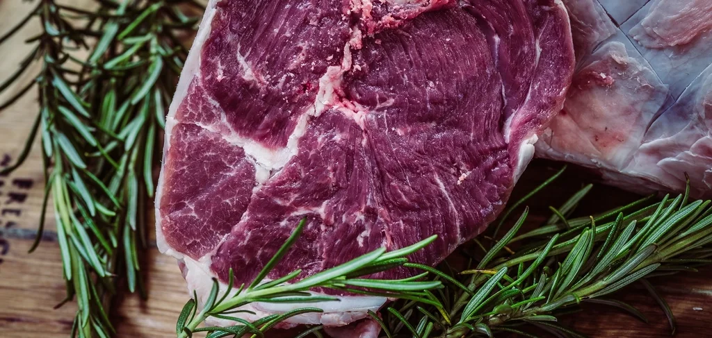 Raw prime beef steak with rosemary